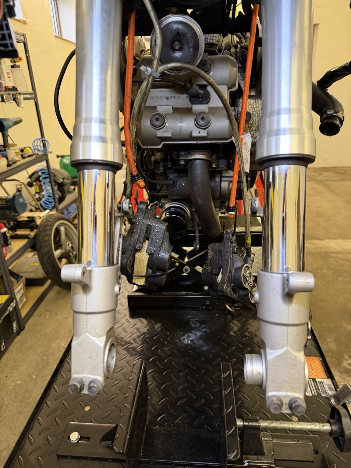 Front forks and exposed engine
