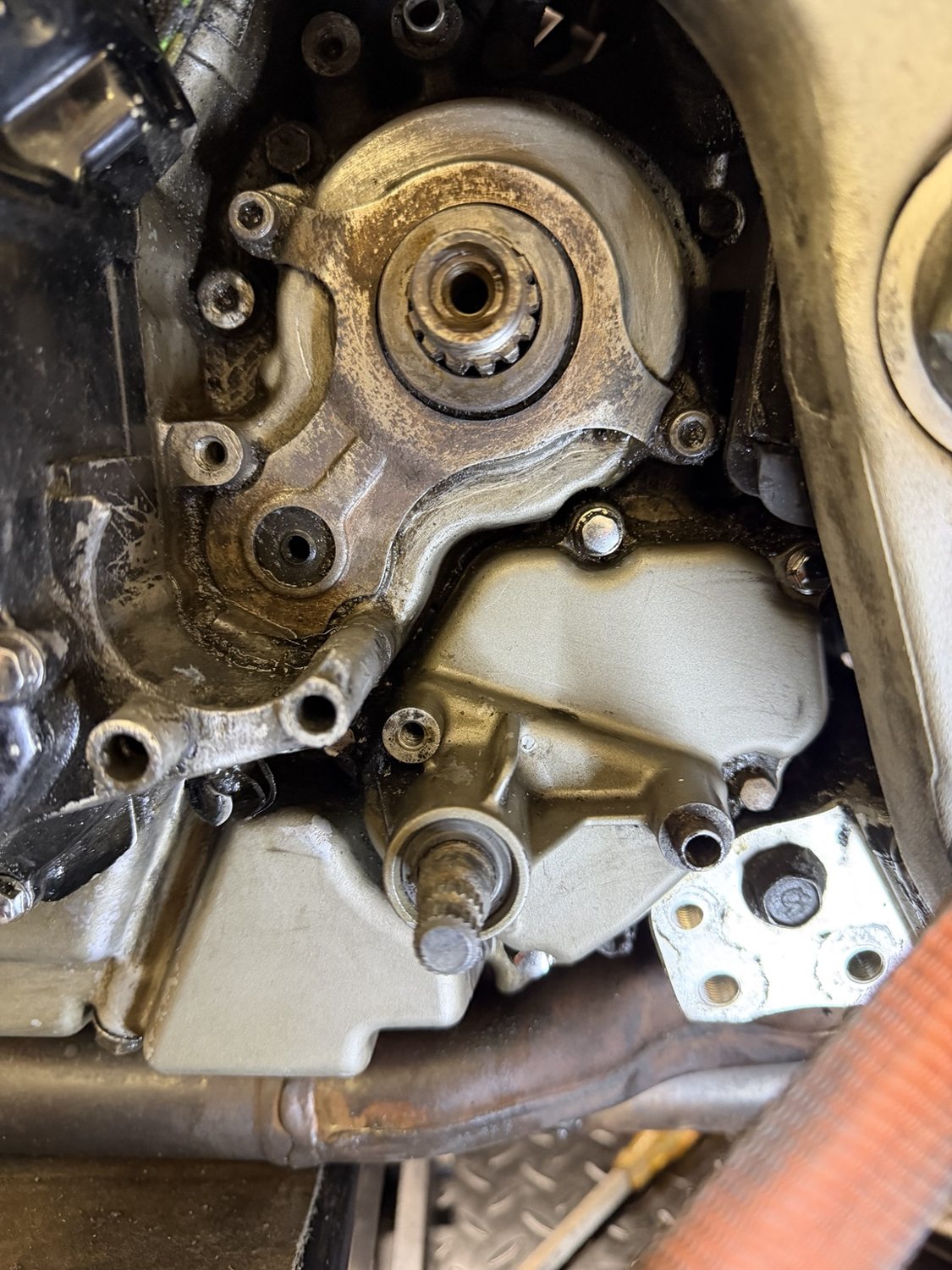 TL1000R front sprocket and gear-selector area after cleaning